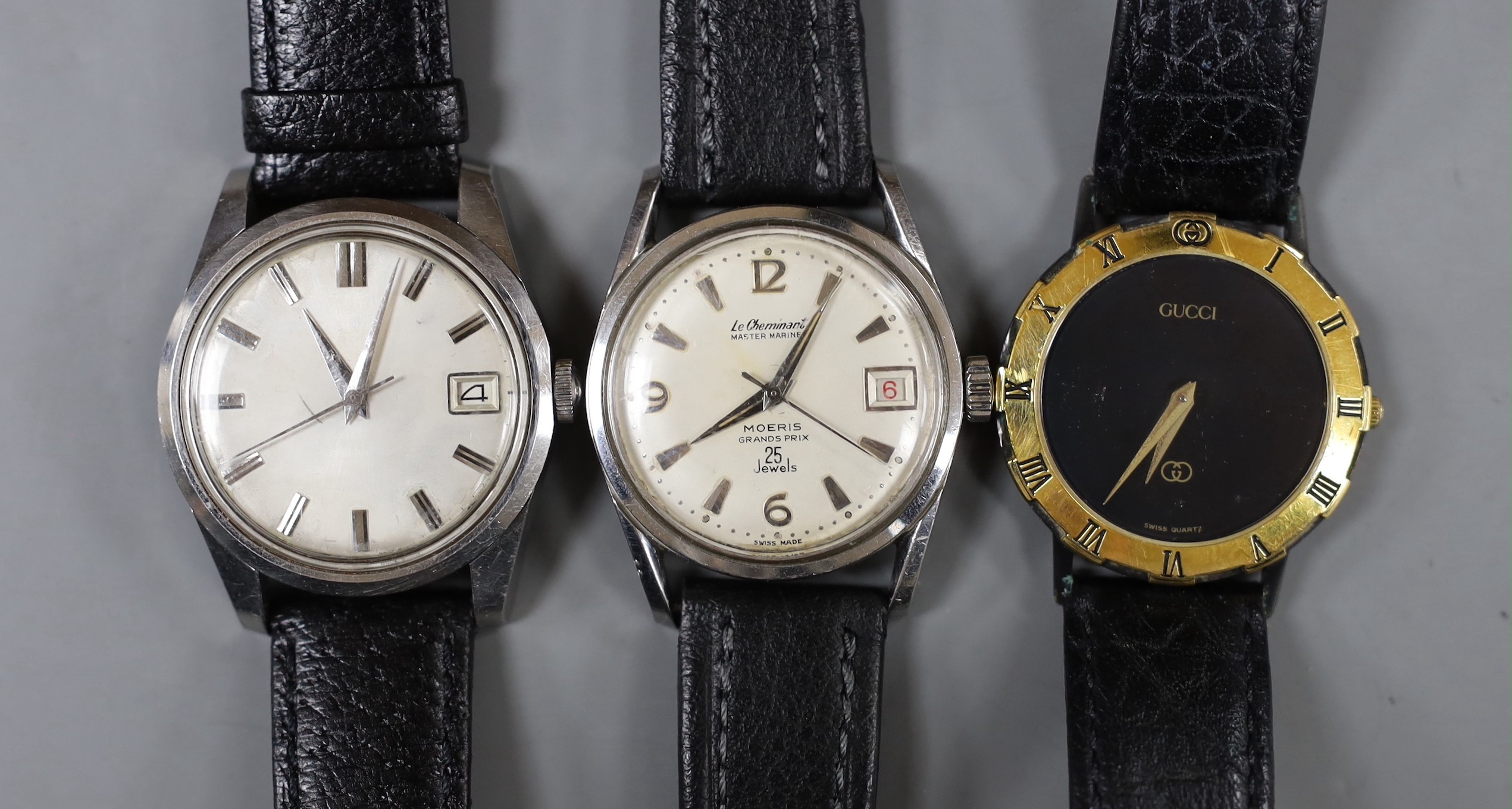 A gentleman's steel Le Chamois wrist watch, a gentleman's gold plated Gucci wrist watch and a gentleman's steel Seahorse wrist watch.